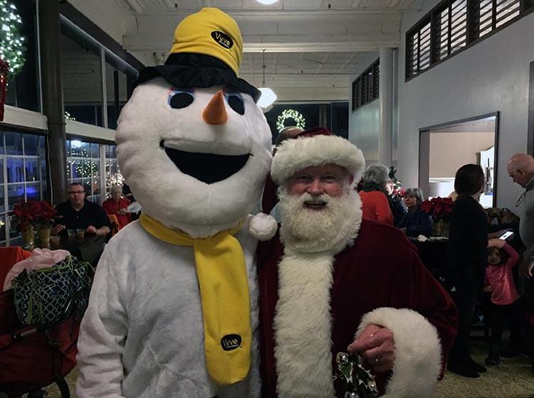 Vyve snowman poses with Santa