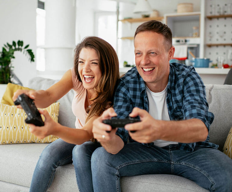 A man and woman playing video games together