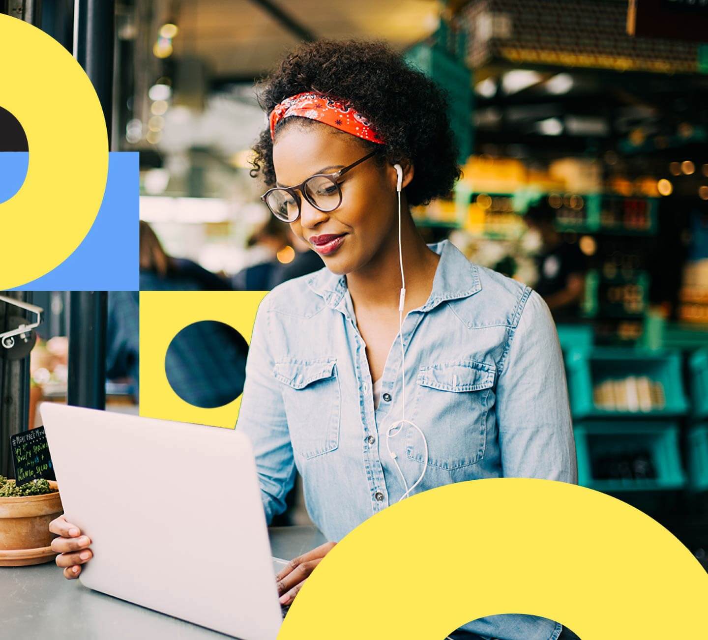 Woman in glasses looking at her laptop