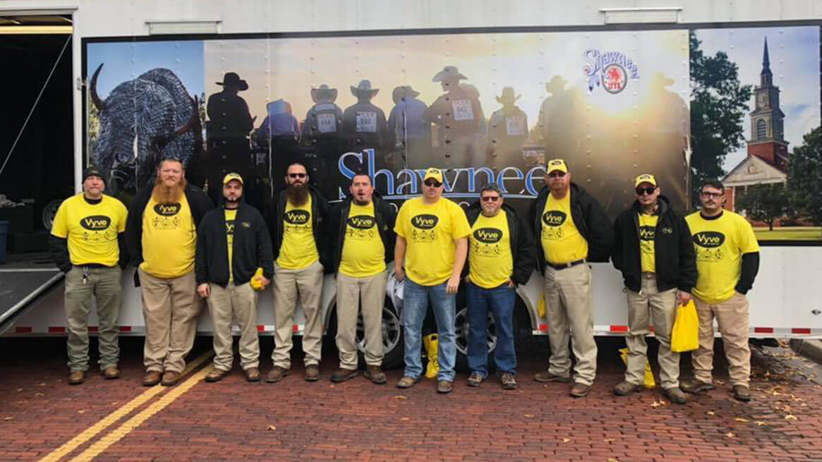 Vyve Technicians pose in front of Shawnee trailer